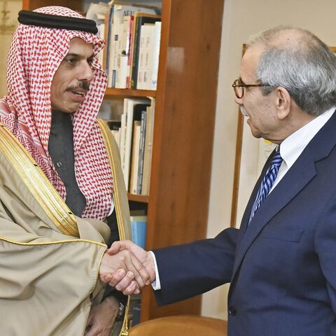 Lebanese Prime Minister-designate Nawaf Salam (R) shakes hands with Saudi Arabia's Foreign Minister Faisal bin Farhan before their meeting in Beirut on Jan. 23, 2025. 