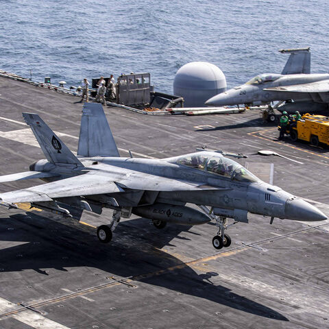 In this US Navy released handout, an F/A-18F Super Hornet, attached to Strike Fighter Squadron (VFA) 41, makes an arrested landing on the flight deck of Nimitz-class aircraft carrier USS Abraham Lincoln in support of Operation Epic Fury, Feb. 28, 2026