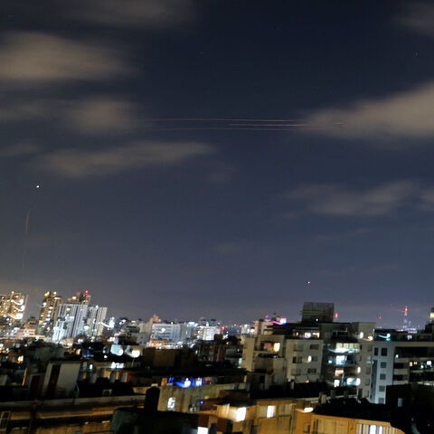 Rocket trails are seen in the sky above the Israeli coastal city of Netanya on June 7, 2026.