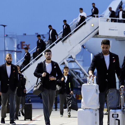 Members of the Iranian national soccer team including midfielder Alireza Jahanbakhsh (R) arrive at Tijuana International Airport on June 7, 2026, in Tijuana, Mexico. 
