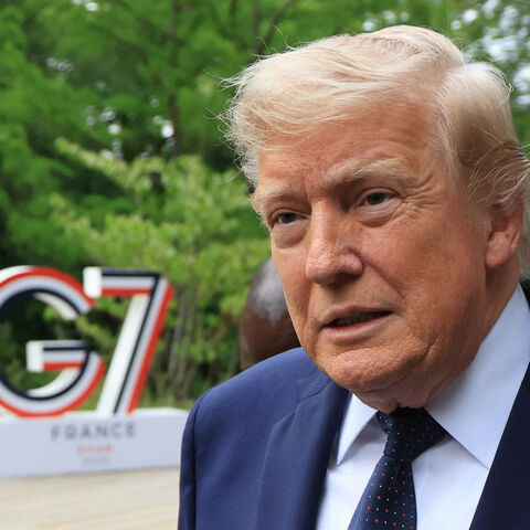 US President Donald Trump arrives to attend a musical interlude before a gala dinner as part of the G7 summit, in Evian, eastern France, on June 16, 2026. 