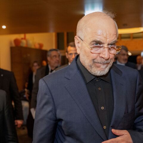 Speaker of the parliament of Iran, Mohammad Bagher Ghalibaf (R), arrives at the Burgenstock resort in Obbuergen, near Lucerne, Switzerland, on June 21, 2026.