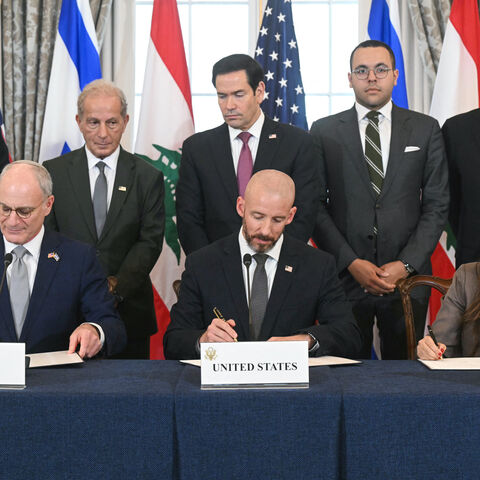 US Secretary of State Marco Rubio (C, back) looks on as (L/R, front row) Israeli Ambassador to the US Yechiel Leiter, State Department Chief of Staff Daniel Holler, and Lebanese Ambassador to the US Nada Hamadeh sign a framework agreement at the US Department of State in Washington, DC, on June 26, 2026. Lebanon, Israel and the United States on Friday signed a trilateral framework agreement aimed at paving the way for a peace deal between the two long-time Middle East adversaries. (Photo by SAUL LOEB / AFP 