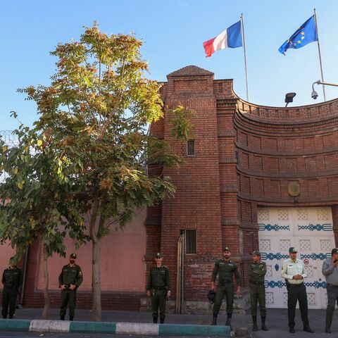 Iranian security forces stand guard in front of the French Embassy in Tehran in this undated image. 