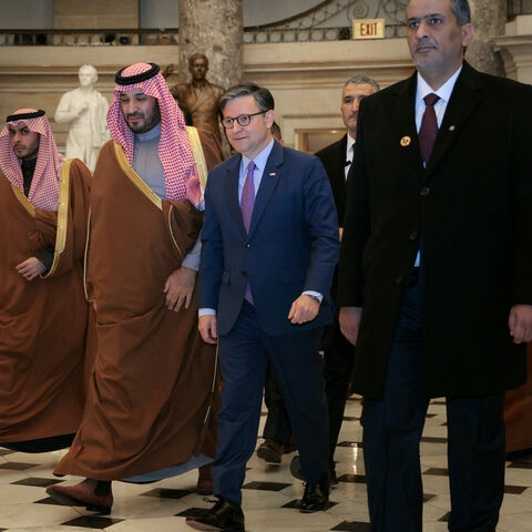 Crown Prince and Prime Minister Mohammed bin Salman of Saudi Arabia (2nd L) is escorted by Speaker of the House Mike Johnson (R-LA) through Statuary Hall as they head to a meeting at the U.S. Capitol on Nov. 19, 2025 in Washington, DC. 