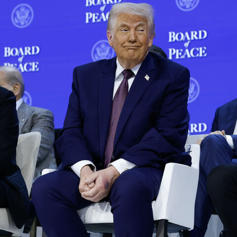DAVOS, SWITZERLAND - JANUARY 22: U.S. President Donald Trump (C) sits in between Prime Minister of Armenia Nikol Pashinyan (L) and Azerbaijan President Ilham Aliyev during a signing ceremony for the “Board of Peace” at the World Economic Forum (WEF) on January 22, 2026 in Davos, Switzerland. The US-backed “Board of Peace” is intended to administer the fragile ceasefire in the Gaza Strip after the war between Israel and Hamas. The final makeup of the board has not been confirmed. (Photo by Chip Somodevilla/G