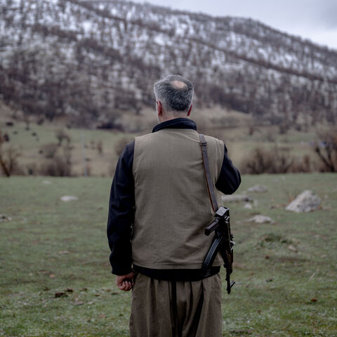 A Kurdish fighter from the Iranian Kurdish armed faction Kurdistan Free Life Party (PJAK) stands with his rifle at a site near the Iraqi border with Iran in Iraq's autonomous Kurdistan region, on March 8, 2026. 