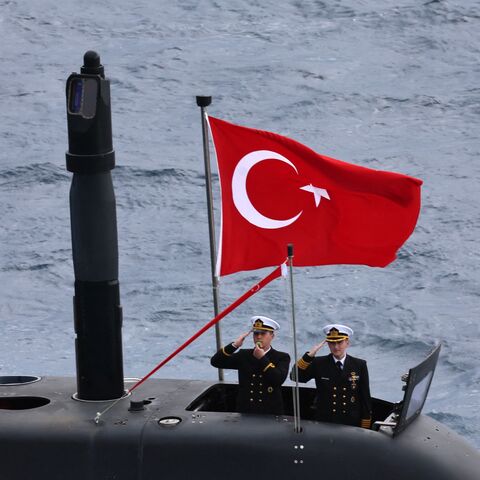 Turkey's servicemen stand at attention on a Turkish submarine as they participate in the live-fire phase of the Blue Homeland 2026  tactical military exercises in the eastern Mediterranean Sea, in Antalya on April 9, 2026. 