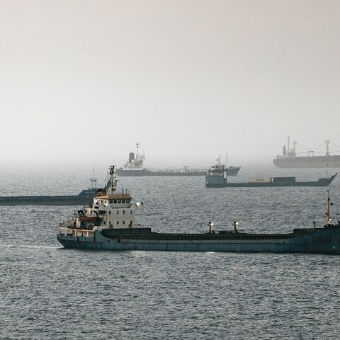 Crude oil tankers, bulk carriers and vessels sit anchored around Qaboos Port on June 22, 2026, in Muscat, Oman. 