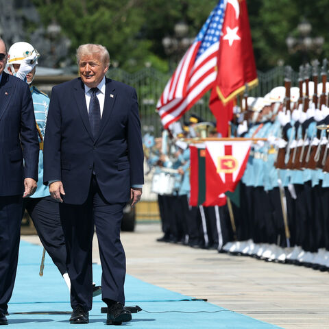 US President Donald Trump walks with Turkish President Recep Tayyip Erdogan during a state arrival ceremony at the Bestepe Presidential Complex for the annual NATO Summit on July 7, 2026 in Ankara, Turkey.