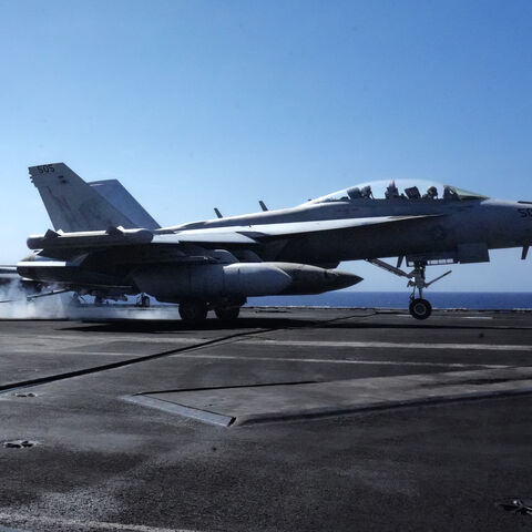 An EA-18G Growler assigned to Electric Attack Squadron (VAQ) 137 lands aboard the aircraft carrier USS Theodore Roosevelt (CVN-71) while the ship is moored in Honolulu, Hawaii, during Exercise RIMPAC (Rim of the Pacific) 2026 on July 17, 2026. 