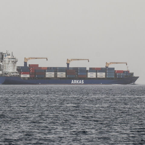 A commercial vessel passes through an international shipping lane off Yemen's Hanish Island in the Red Sea on July 27, 2026. 