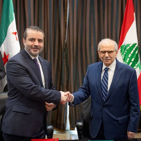 Nawaf Salam and Asaad al-Shibani shake hands in Beirut on July 2, 2026. 