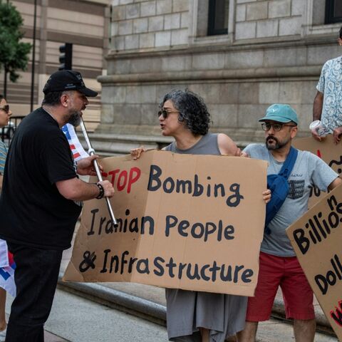 Protesters for and against the Iran war confront each other during a rally in the US city of Boston on Sunday