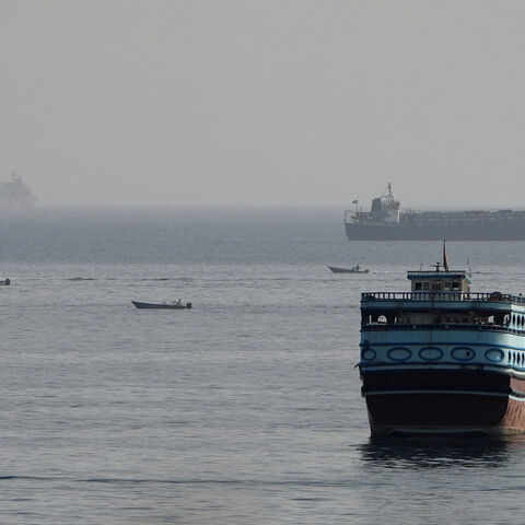 FILE PHOTO: Vessels in the Strait of Hormuz, as seen from Musandam, Oman, August 3, 2026. REUTERS/Stringer/File Photo