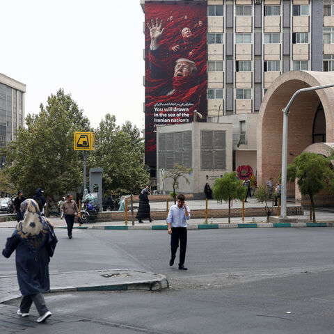 A billboard depicting U.S. President Donald Trump and Israeli Prime Minister Benjamin Netanyahu that reads "You will drown in the sea of the Iranian nation's revenge", on a building in Tehran, Iran, August 3, 2026. Majid Asgaripour/WANA (West Asia News Agency) via REUTERS