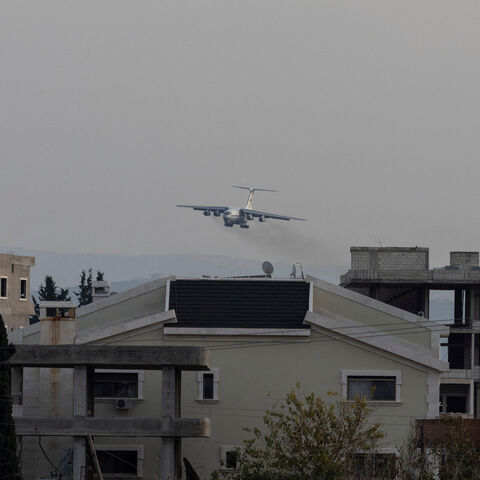 FILE PHOTO: A Russian military aircraft approaches the Hmeimim air base in Syria's coastal Latakia, Syria, December 15, 2024. REUTERS/Umit Bektas/File Photo