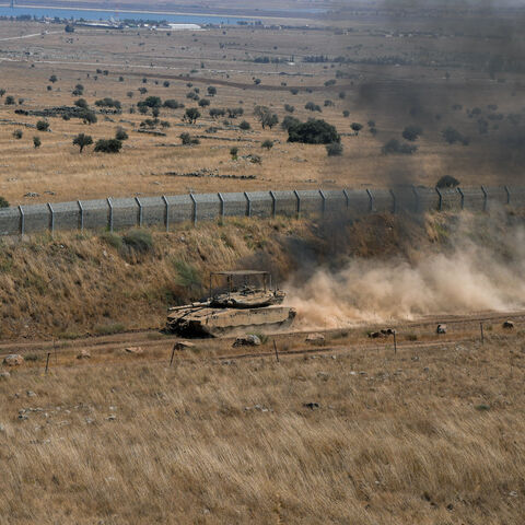 An Israeli tank drives along the ceasefire line between the Israeli-occupied Golan Heights and Syria, on its Israeli side August 20, 2026. REUTERS/Ayal Margolin