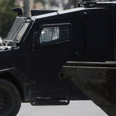 FILE PHOTO: Israeli forces point their weapons as they take part in a raid in Qalandia refugee camp, in the Israeli-occupied West Bank, August 25, 2026. REUTERS/Ammar Awad/File Photo — Ammar Awad