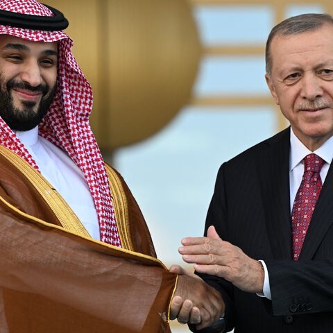 Turkish President Recep Tayyip Erdogan (R) welcomes Saudi Crown Prince Mohammed bin Salman (L) upon his arrival during an official ceremony at the Presidential Complex in Ankara on June 22, 2022.
