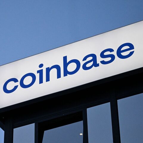 This photograph taken on Jan. 21, 2026, shows signage of the Coinbase logo during the World Economic Forum meeting in Davos. — INA FASSBENDER / AFP via Getty Images