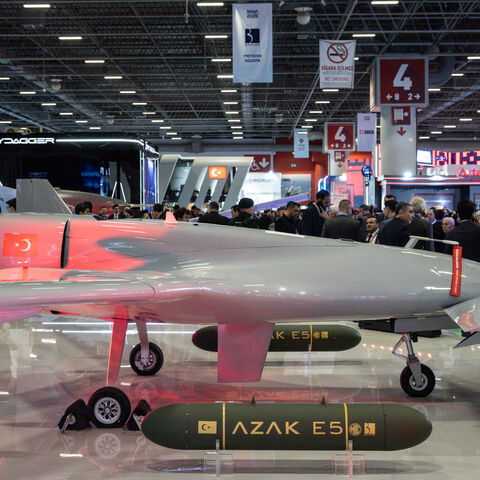 People look at a drone on display at the Baykar exhibit at the SAHA International Defense and Aerospace Expo on May 6, 2026 in Istanbul, Turkey. 