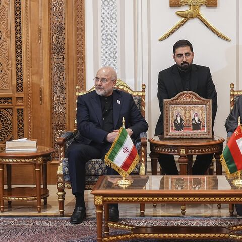 Iranian Foreign Minister Abbas Araghchi (L), Iranian parliament speaker Mohammad Bagher Ghalibaf (2nd L) and Omani Foreign Minister Badr bin Hamad Al Busaidi (R) attend a meeting in Muscat, Oman, on June 22, 2026.