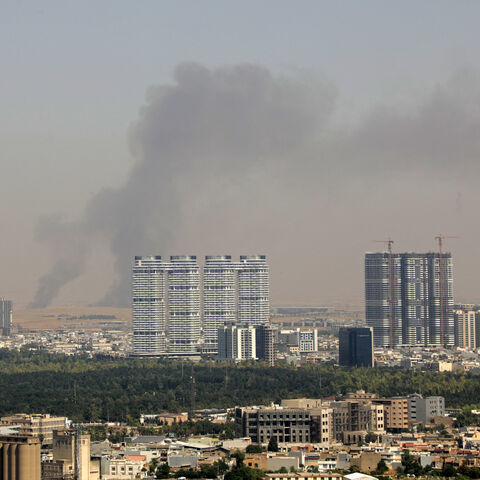 Smoke rises after explosions were heard and air defences activated near the airport in Erbil, on July 24, 2026.  