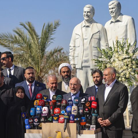 Iranian parliament speaker Mohammad Bagher Ghalibaf speaks during a press conference at the site where Qasem Soleimani, commander of the Quds Force of Iran's Islamic Revolutionary Guard Corps, was killed by a US airstrike in 2020 near the airport upon his arrival in Baghdad, on Aug. 19, 2026.