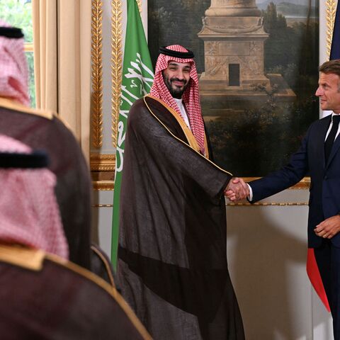 France's President Emmanuel Macron and Saudi Arabia's Crown Prince Mohammed bin Salman shake hands