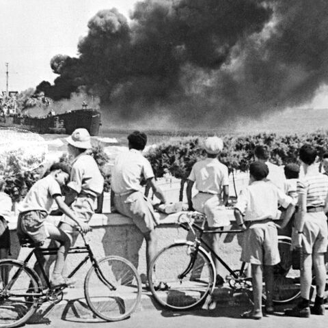 A merchant ship "Jabotinsky" (former "Altalena"), chartered by Jewish military group Irgun Zvaei Leumi to carry weapons for Israeli fighters, burns near Tel Aviv beach, after being shelled by the Haganah, Israel, June 27, 1948.