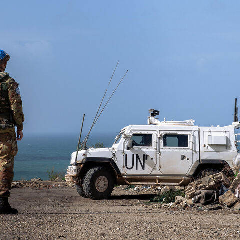 UN peacekeepers stand next to an armored vehicle during a patrol in southern Lebanon, Feb. 22, 2026.