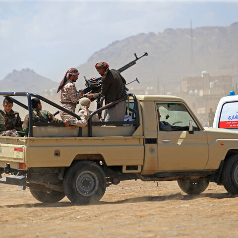 Supporters of the Iran-backed Houthi movement, arrive with their weapons to rally in solidarity with Iran and Lebanon, in Sanaa on April 8, 2026, following the announcement of a ceasefire in the Middle East war.  