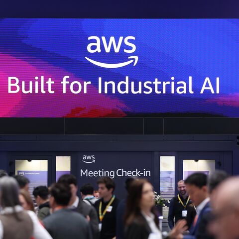 Visitors crowd the Amazon Web Services exhibition stand at the 2026 Hannover Messe industrial trade fair on April 20, 2026, in Hanover, Germany. 