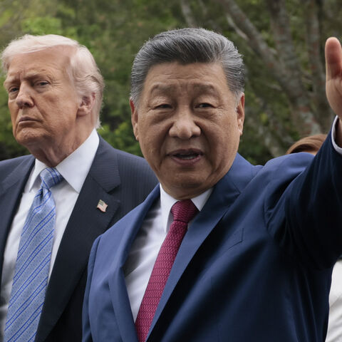BEIJING, CHINA - MAY 15: U.S. President Donald Trump and Chinese President Xi Jinping tour Zhongnanhai Garden on May 15, 2026 in Beijing, China. Trump and other U.S. officials are finishing up a visit intended to address the Iran conflict, trade imbalances, and the Taiwan situation while establishing new bilateral boards for economic and AI oversight. (Photo by Evan Vucci-Pool/Getty Images)
