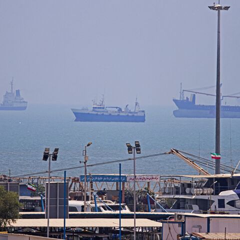 In this picture obtained from Iran's ISNA news agency on June 18, 2026, vessels are seen anchored in Bandar Abbas along the Strait of Hormuz. 