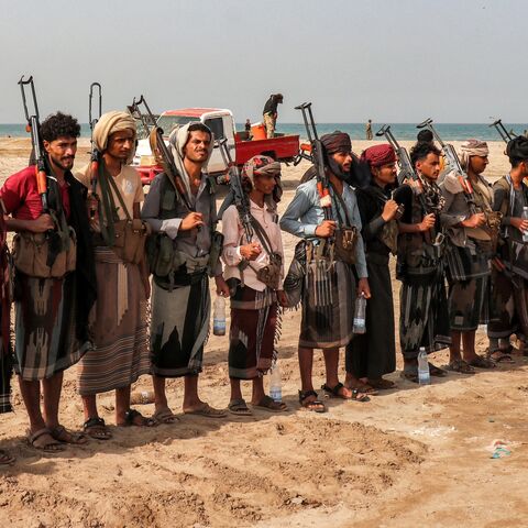 Fighters supporting the Aden-based internationally recognized Yemeni government gather during a vigil along the Red Sea shore in Khokha, in Yemen's western Hodeidah province, on July 20, 2026, calling for a resumption of hostilities with the Houthi group currently controlling the capital, Sanaa.