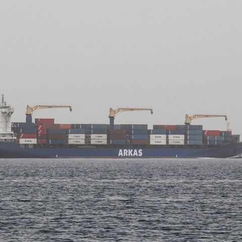 A commercial vessel passes through an international shipping lane off Yemen's Hanish Island in the Red Sea on July 27, 2026. 