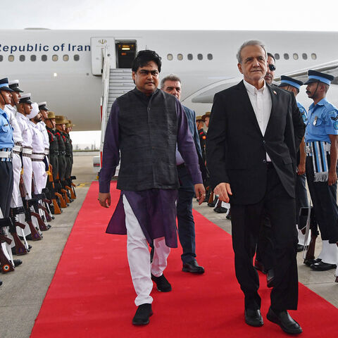 Iran's President Masoud Pezeshkian disembarks from his plane