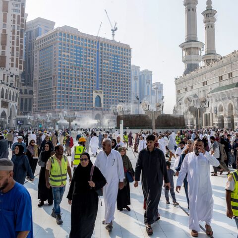 People and pilgrims walk at the Grand Mosque Complex in Saudi Arabia's holy city of Mecca on Sept. 16, 2026.