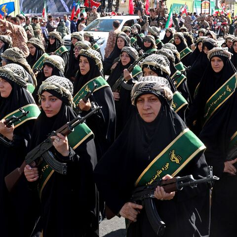 Members of Iran's Basij paramilitary force march 