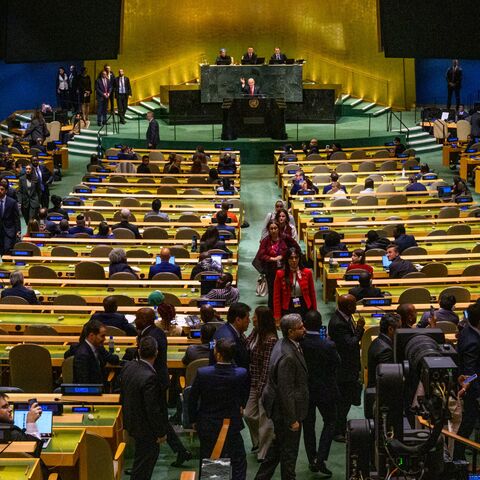 Prime Minister of Israel Benjamin Netanyahu waves to delegates leaving before his UN speech