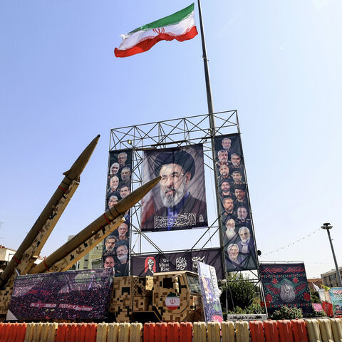 Iranian-made Zolfaghar missiles are seen on display beside a large portrait of Iran's supreme leader Mojtaba Khamenei at Baharestan Square in Tehran on Sept. 28, 2026. 