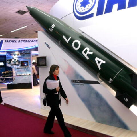A woman walks past a model of a Lora missile, Israel's long range artillery missile at the Israel defence stall at the international DefExpo 2008 defence fair, in New Delhi on February 16, 2008. India kicked off South Asia's largest defence fair, with hundreds of global weapons firms offering their latest hardware to the country's technology-hungry military. About 450 weapons companies from 30 countries are present at the four-day "DefExpo" in New Delhi, with several big-ticket announcements expected. AFP P