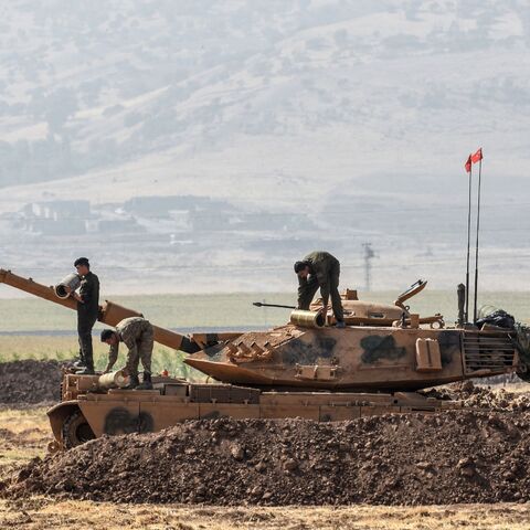 Turkish soldiers conduct military exercises near the Habur crossing gate between Turkey and Iraq on Sept. 27, 2017 in the Silopi district, southeast Turkey.