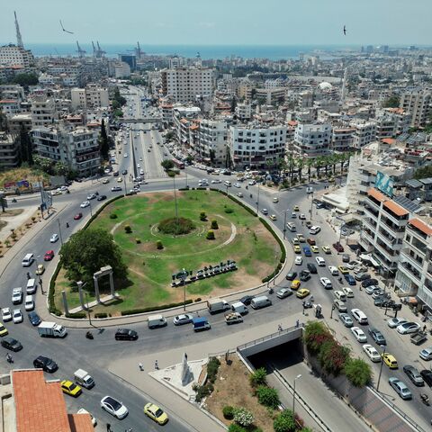 A view of a traffic roundabout in central Latakia, Syria on June 12, 2025. The city's road network converges near the coast, forming one of the busiest urban intersections in the province. (Photo by Omar Albaw / Middle East Images via AFP) (Photo by OMAR ALBAW/Middle East Images/AFP via Getty Images)