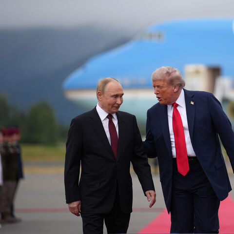 ANCHORAGE, ALASKA - AUGUST 15: U.S. President Donald Trump (R) walks with Russian President Vladimir Putin as they arrives at Joint Base Elmendorf-Richardson on August 15, 2025 in Anchorage, Alaska. The two leaders are meeting for peace talks aimed at ending the war in Ukraine. (Photo by Andrew Harnik/Getty Images)