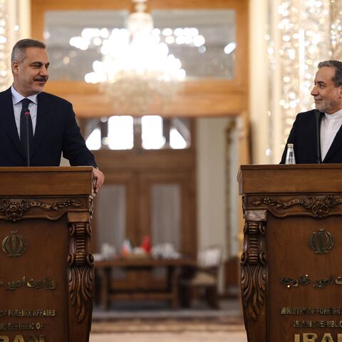 Turkey's Foreign Minister Hakan Fidan (L) and Iran's Foreign Minister Abbas Araghchi holds a press conference in Tehran on November 30, 2025. 