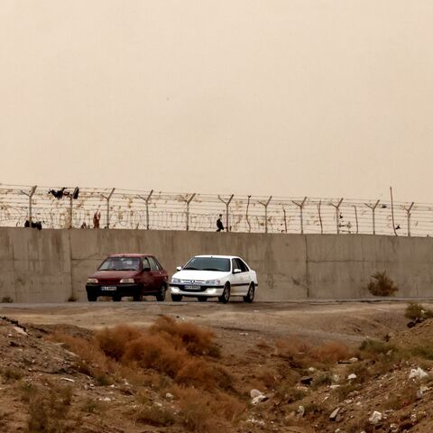 This picture shows the border wall between Iran and Afghanistan at the Milak border crossing near the town of Zabol, in the southeastern province of Sistan and Baluchistan bordering Afghanistan, on Dec. 17, 2025. 