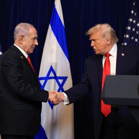 US President Donald Trump shakes hands with Israeli Prime Minister Benjamin Netanyahu during a press conference at his Mar-a-Lago club on Dec. 29, 2025, in Palm Beach, Florida.